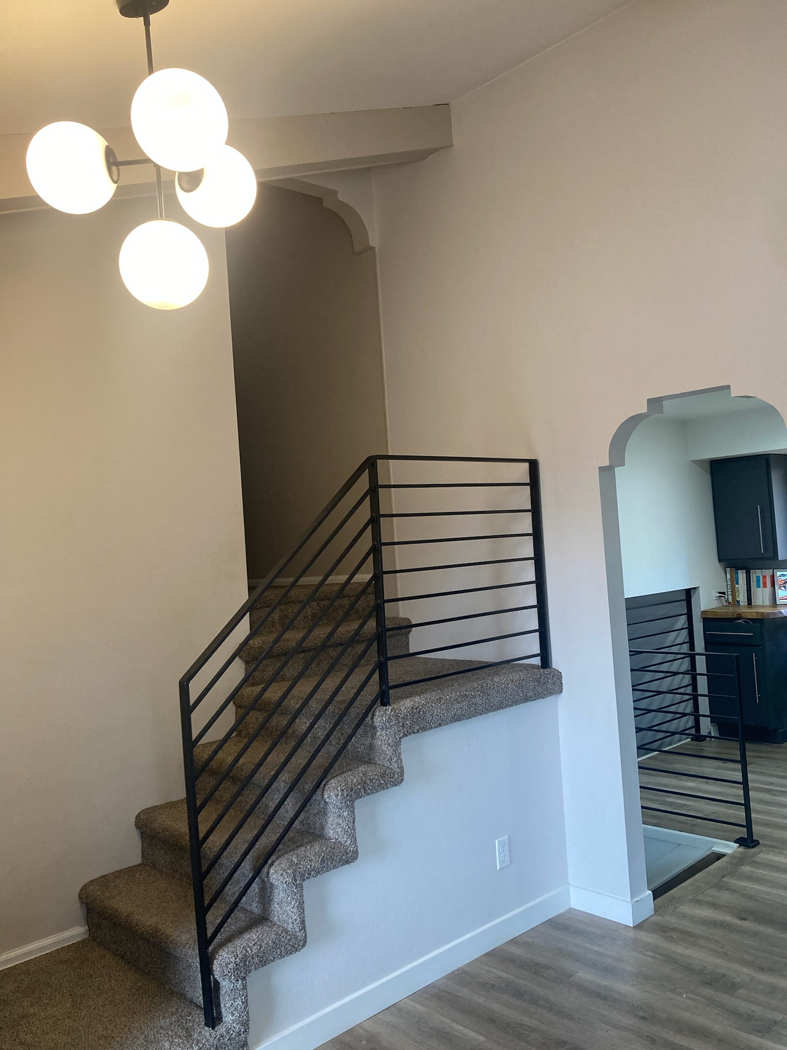 Interior wood loft railings and live-edge counter