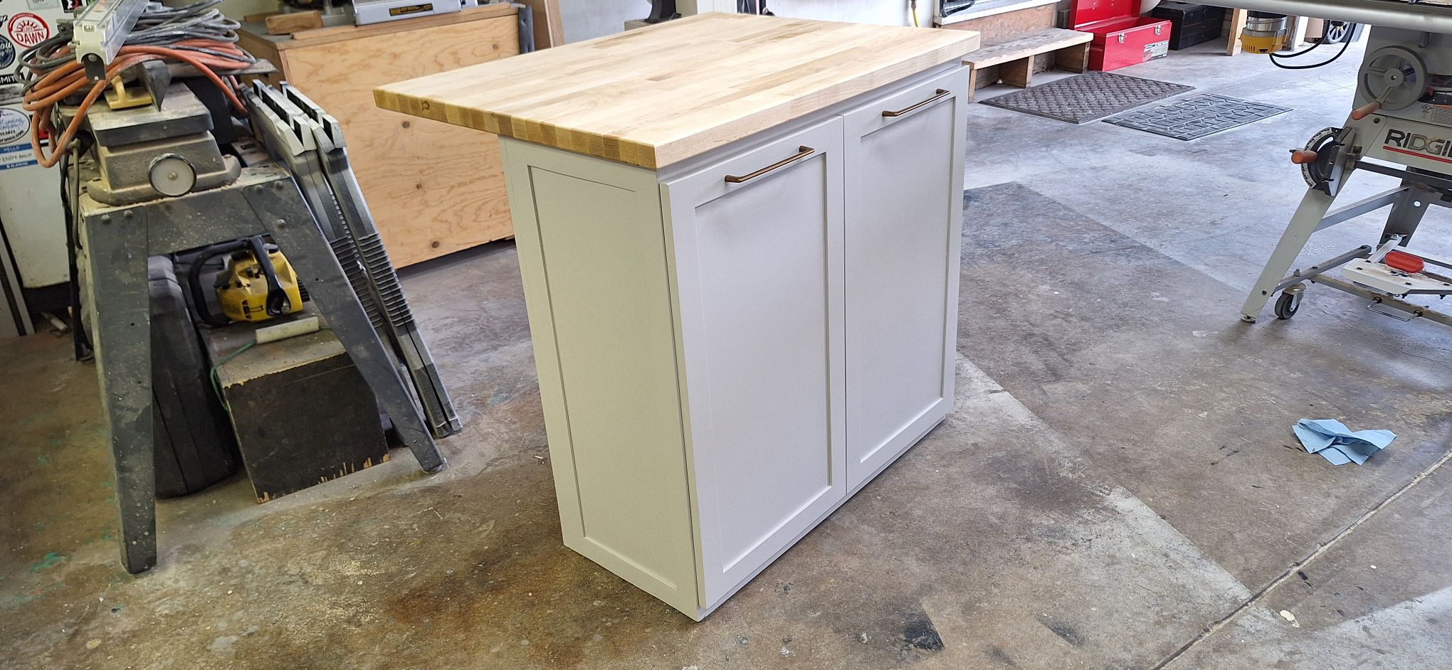 White shaker cabinet with butcher block top